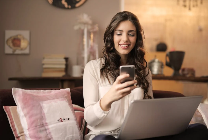 Woman looking at pictures on her phone